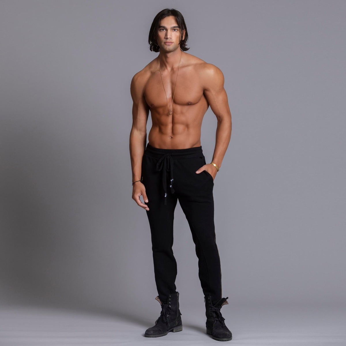 A man modeling black colored jogger pants