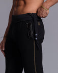A man modeling black colored jogger pants
