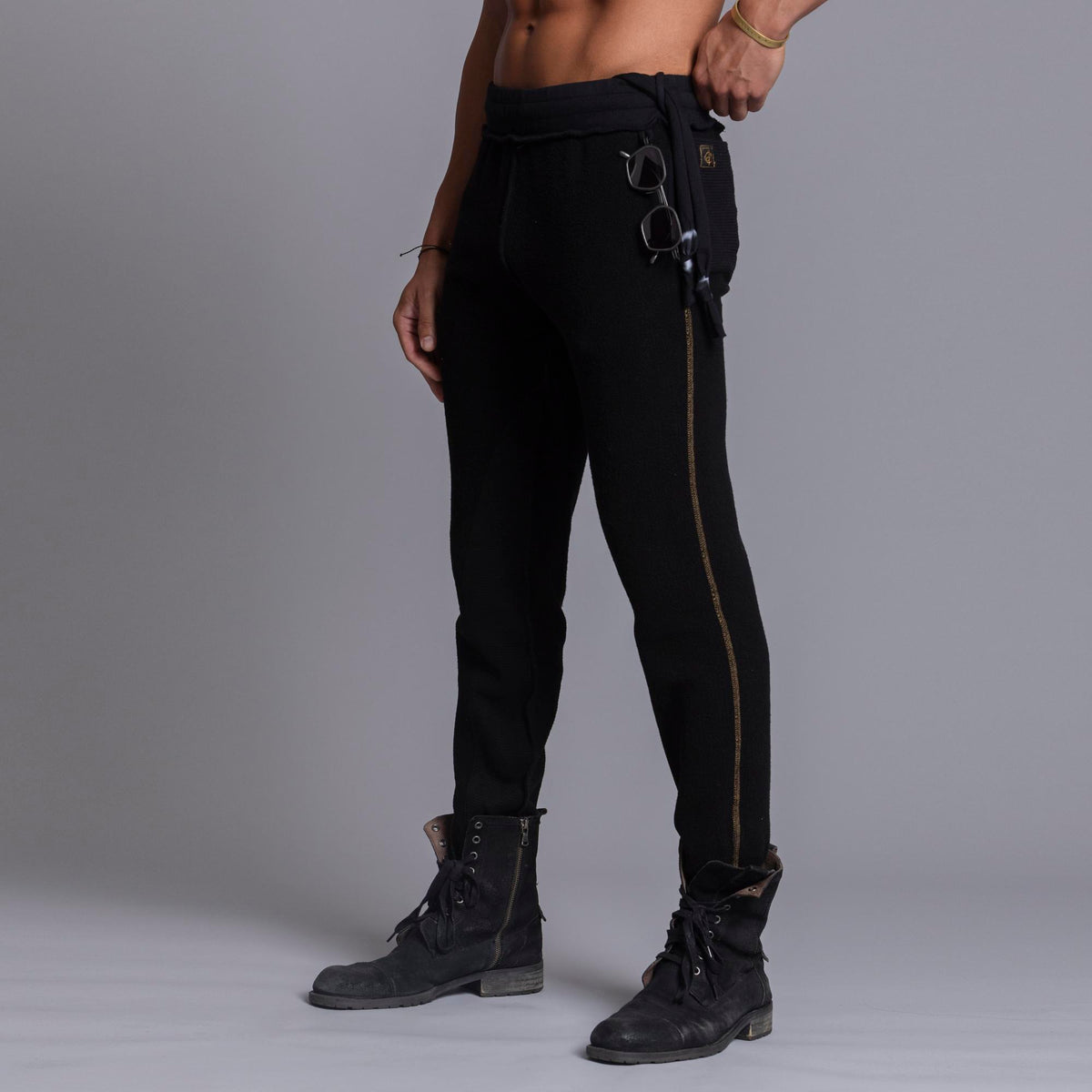 A man modeling black colored jogger pants