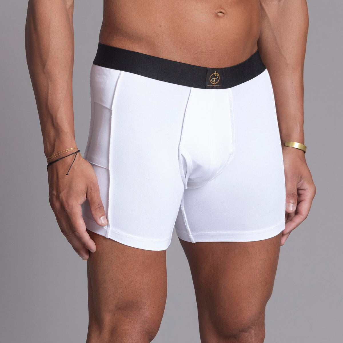 A man modeling the One Golden Thread Unders in White