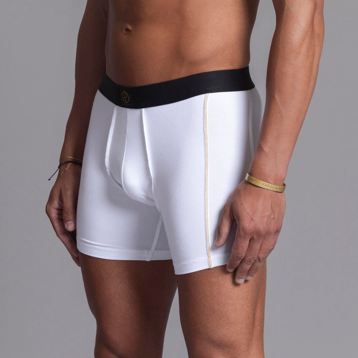 A man modeling the One Golden Thread Unders in White
