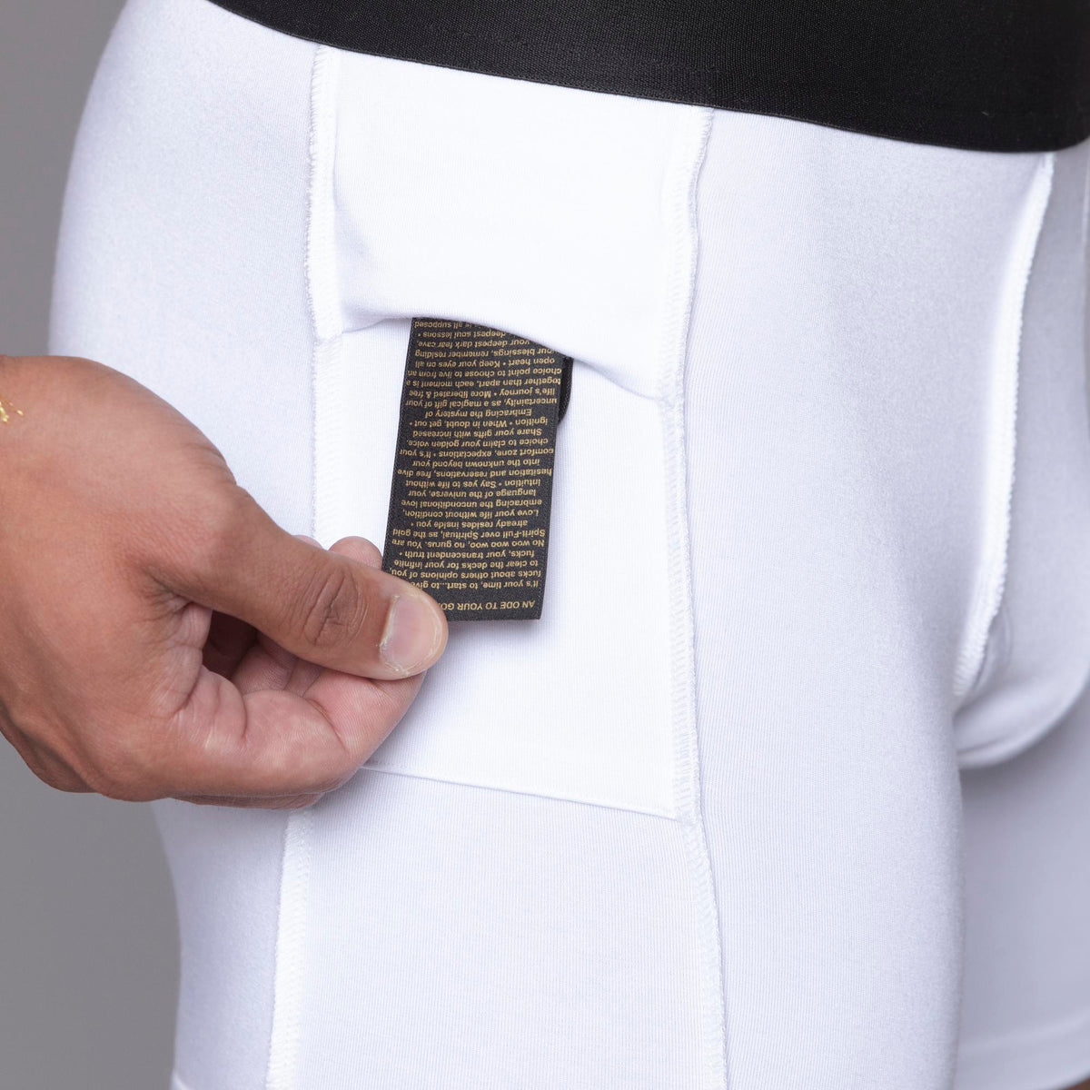 A man modeling the One Golden Thread Unders in White