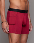 A man modeling the One Golden Thread Unders in Wine Red