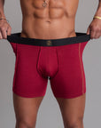 A man modeling the One Golden Thread Unders in Wine Red