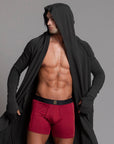 A man modeling the One Golden Thread Unders in Wine Red