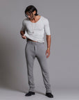 Man modeling the milano pant in deep clay gray