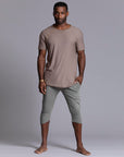 Male modeling Green Clay colored yogo mid shorts