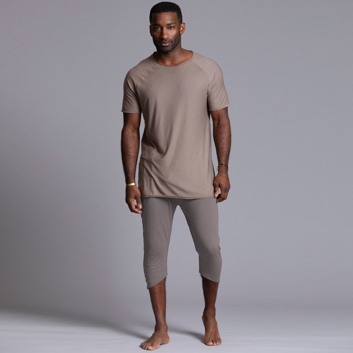 Male modeling Deep Clay gray colored yogo mid shorts