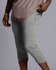 Male modeling Green Clay colored yogo mid shorts