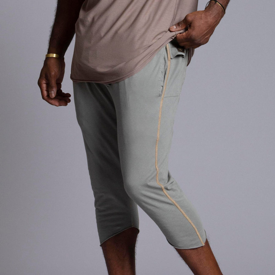 Male modeling Green Clay colored yogo mid shorts