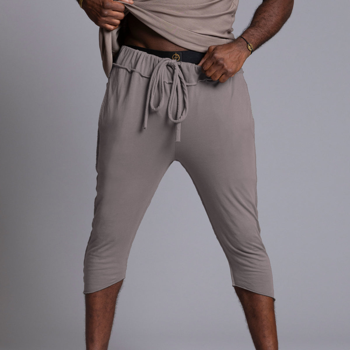 Male modeling Deep Clay gray yogo mid shorts