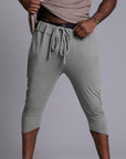 Male modeling Green Clay colored yogo mid shorts