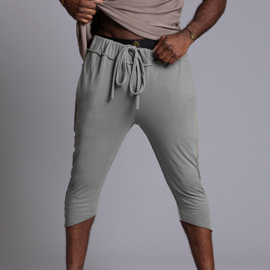 Male modeling Green Clay colored yogo mid shorts