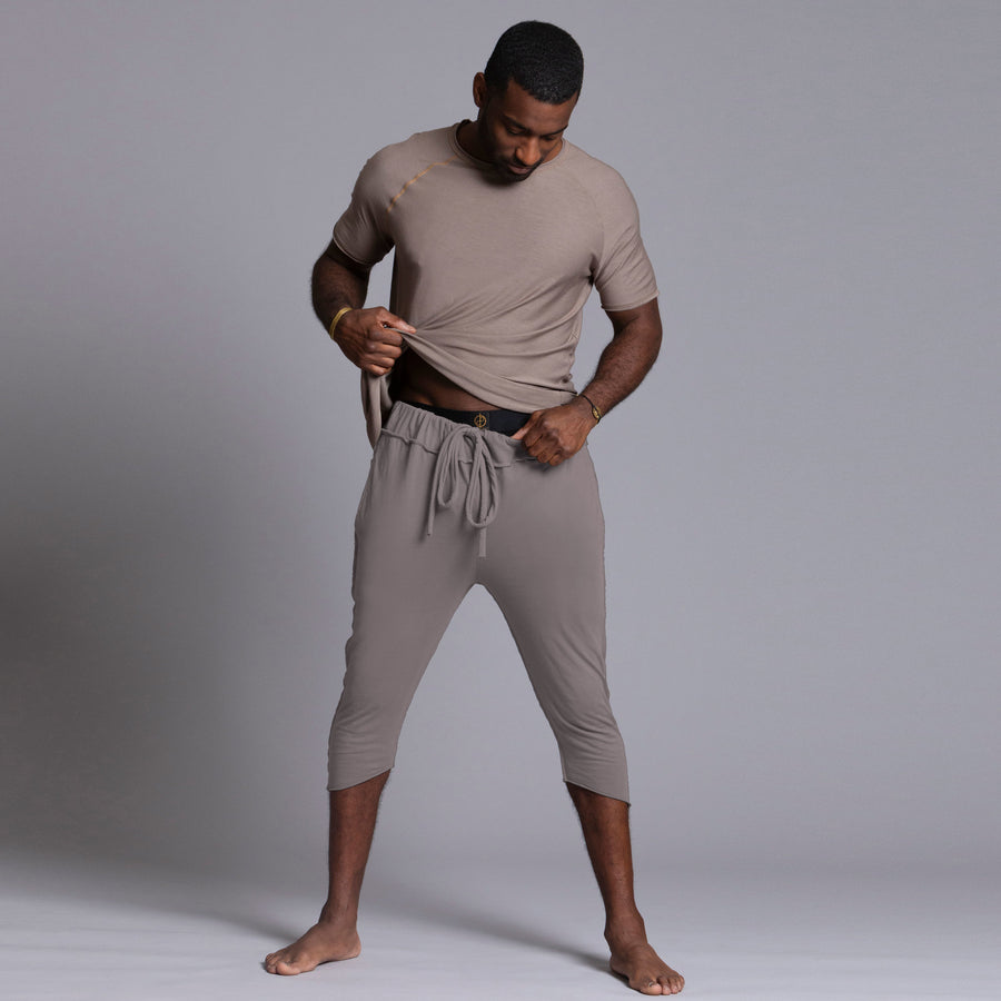 Male modeling Deep Clay gray colored yogo mid shorts