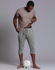 Male modeling Green Clay colored yogo mid shorts