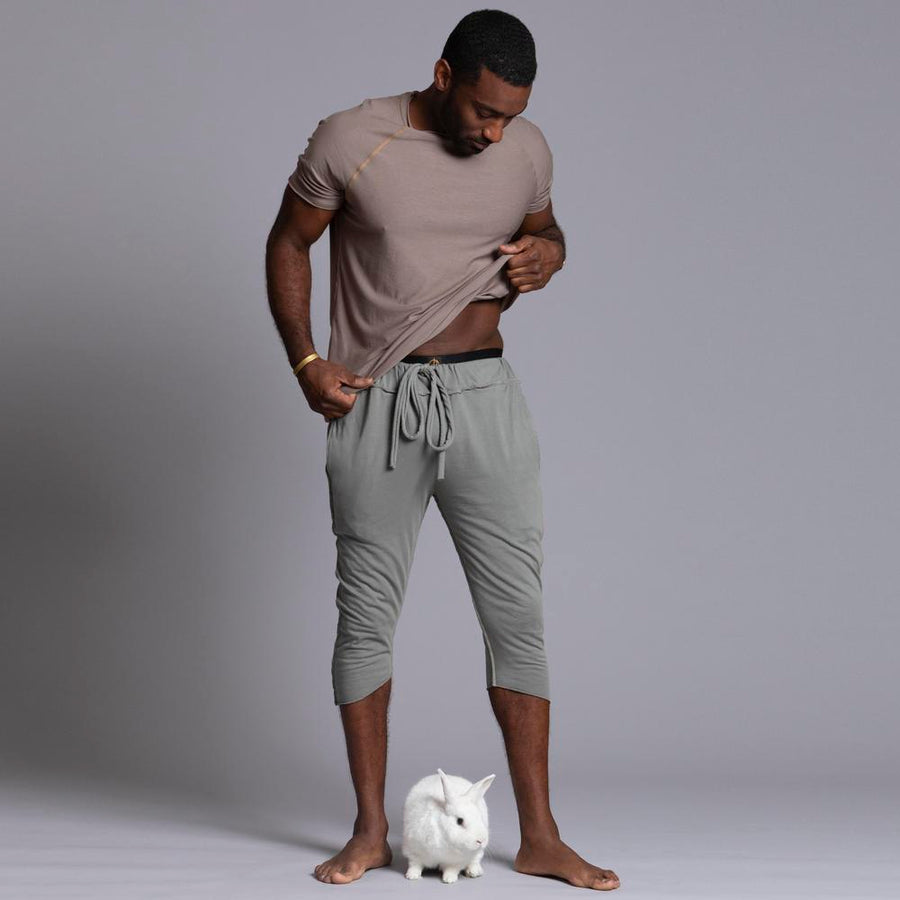 Male modeling Green Clay colored yogo mid shorts