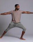 Male modeling Green Clay colored yogo mid shorts
