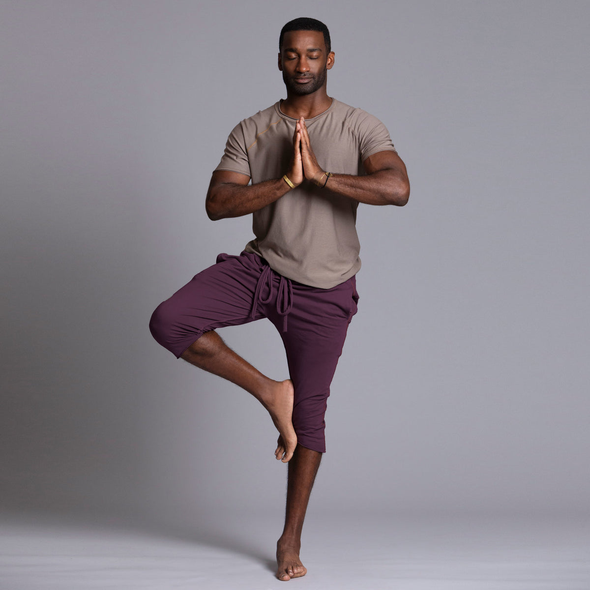 Male modeling Eggplant colored yogo mid pants