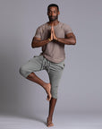 Male modeling Green Clay colored yogo mid shorts