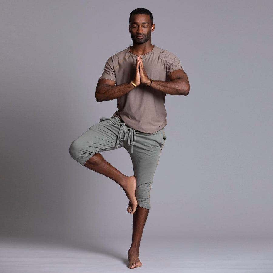 Male modeling Green Clay colored yogo mid shorts