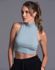 Woman modeling high neck crop in Agave