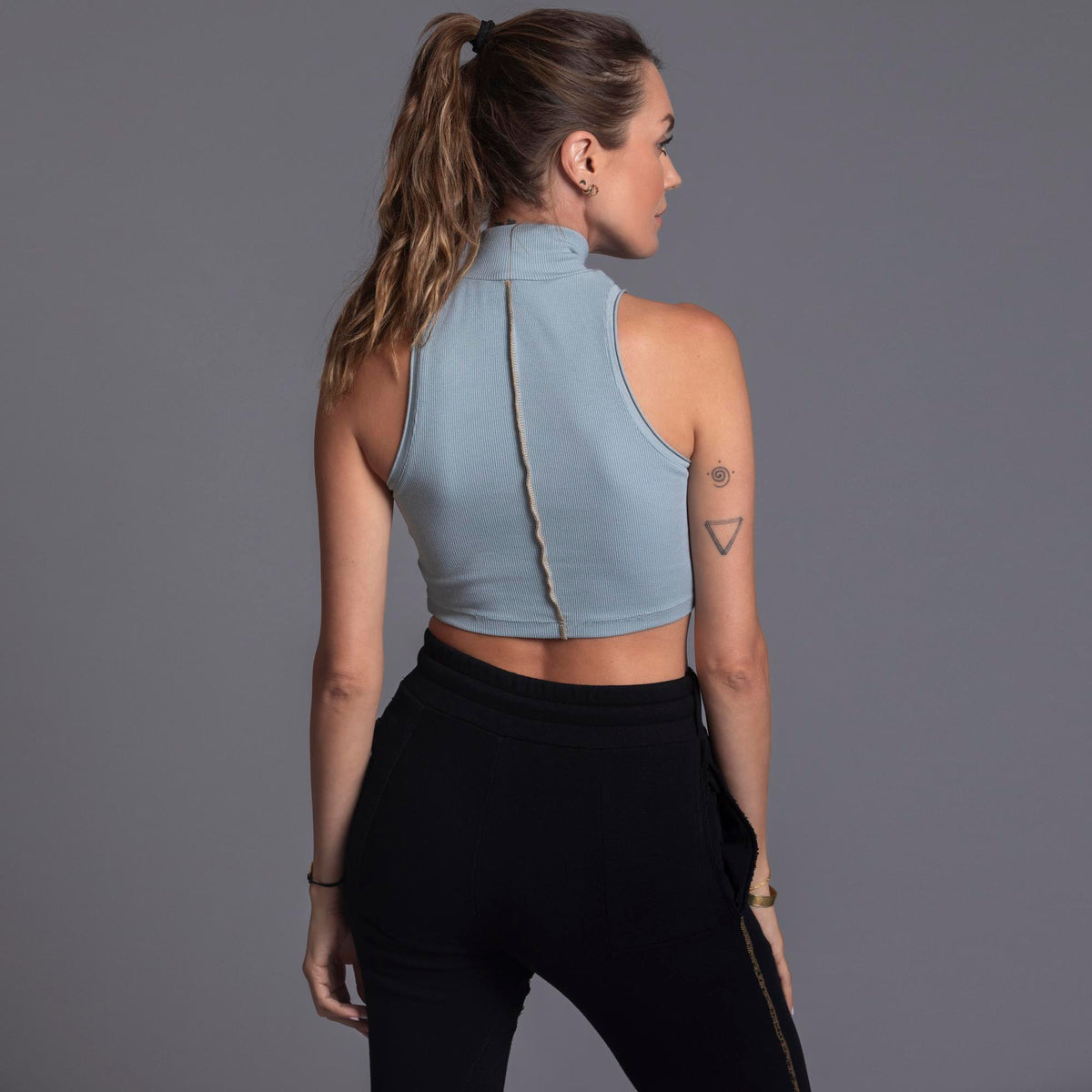 Woman modeling high neck crop in Agave