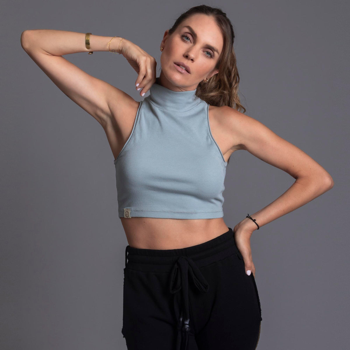 Woman modeling high neck crop in Agave