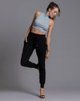 A woman modeling the One Golden Thread Jogga Pants in Black