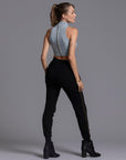 A woman modeling the One Golden Thread Jogga Pants in Black