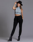 A woman modeling the One Golden Thread Jogga Pants in Black