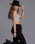 A woman modeling the One Golden Thread Jogga Pants in Black