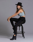 A woman modeling the One Golden Thread Jogga Pants in Black