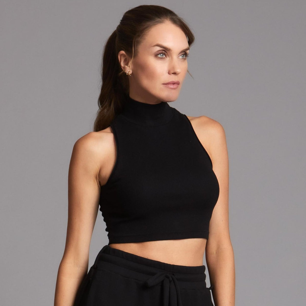 Woman modeling high neck crop in Black