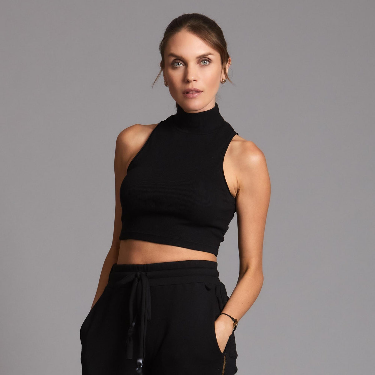 Woman modeling high neck crop in Black