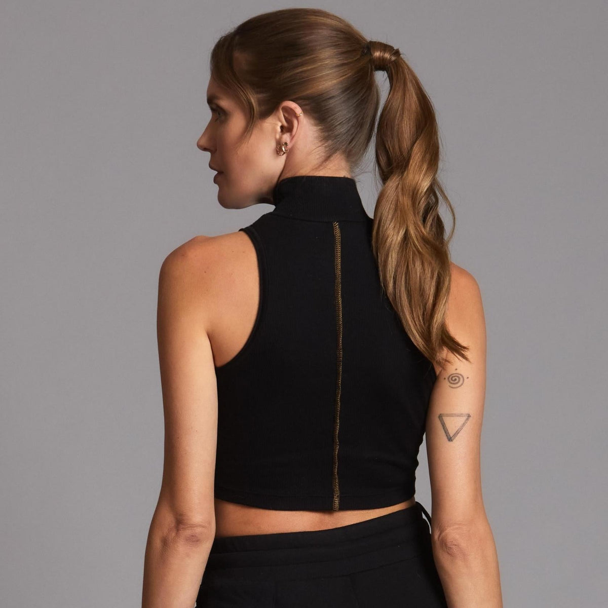 Woman modeling high neck crop in Black