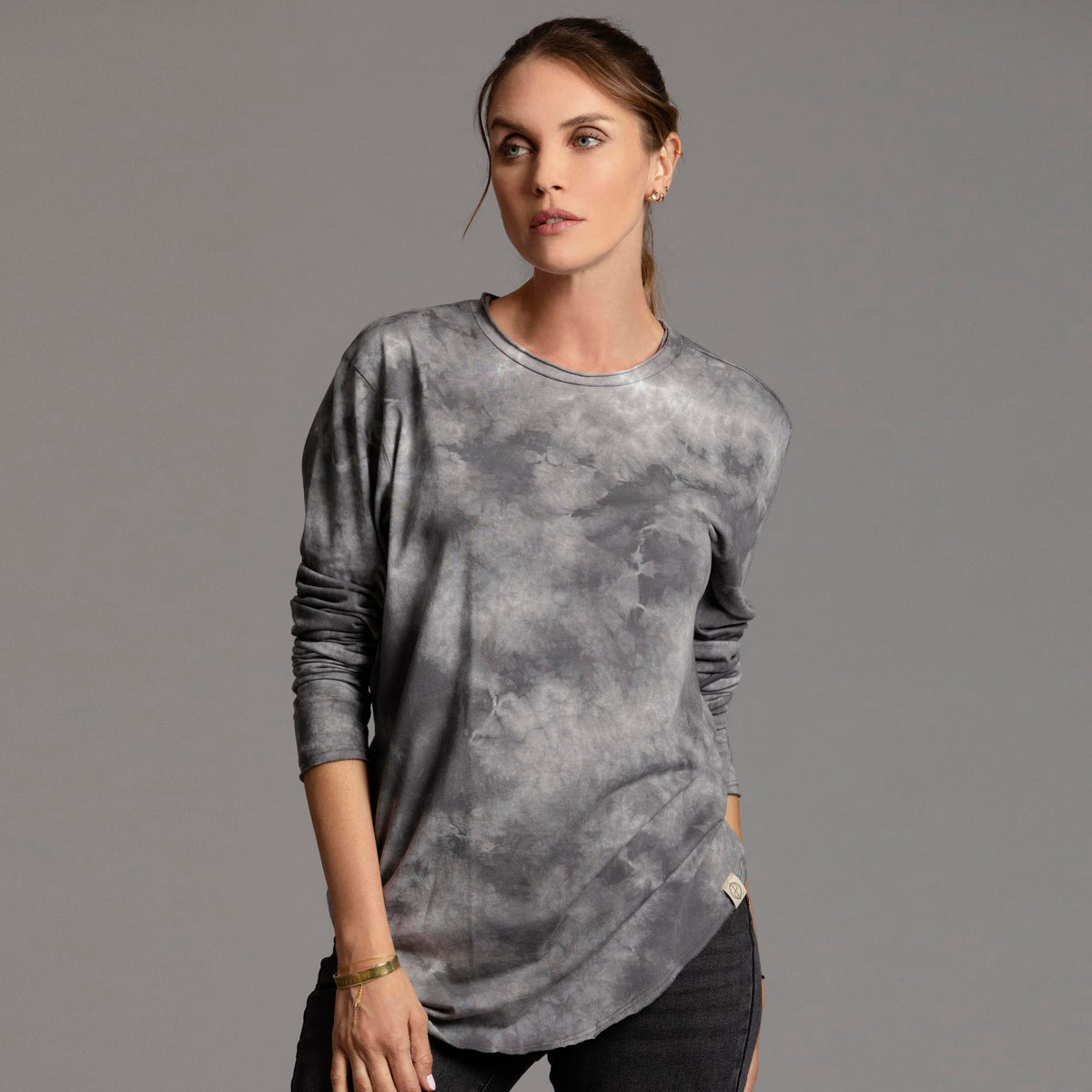 Woman modeling long sleeve crew shirt in rain cloud