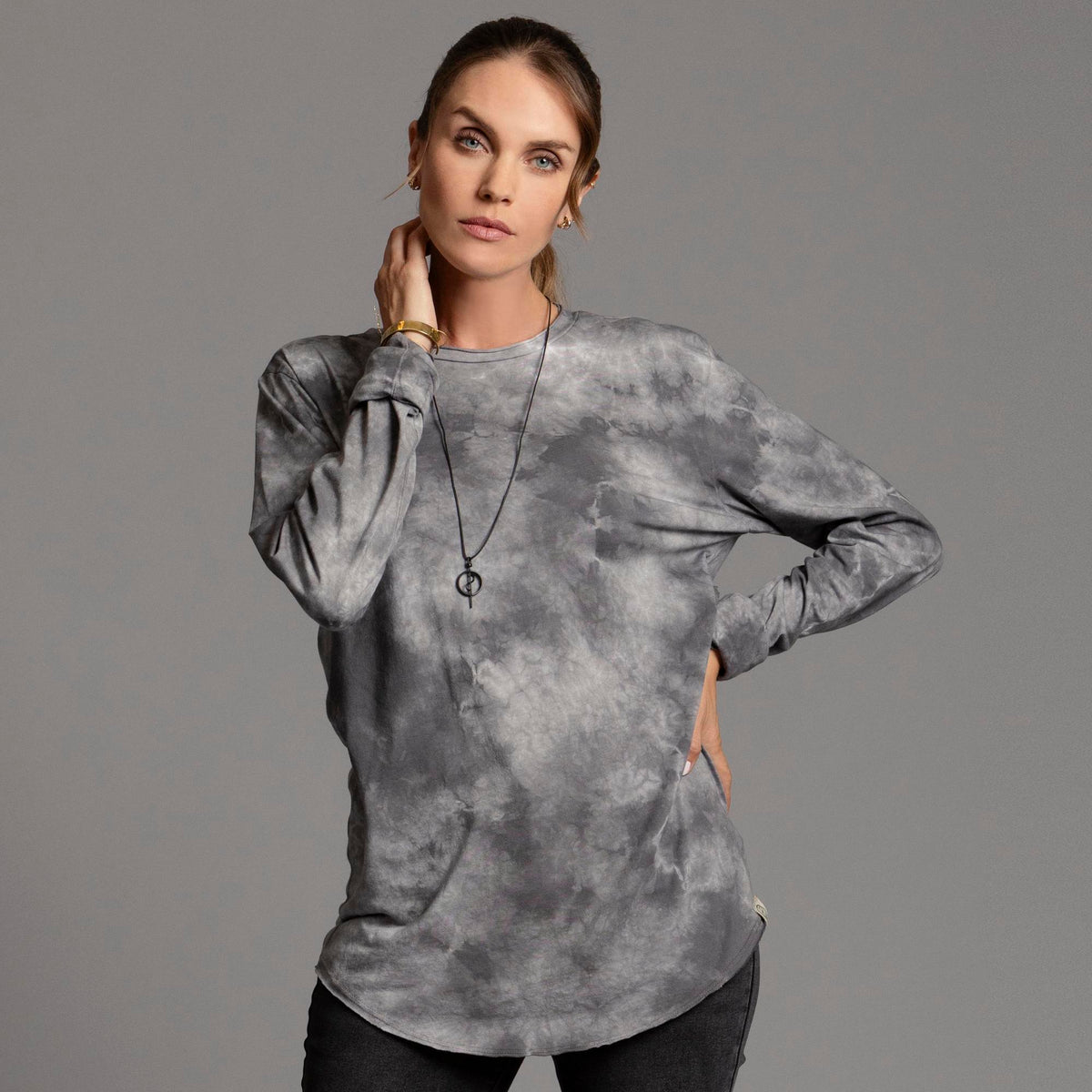 Woman modeling long sleeve crew shirt in rain cloud