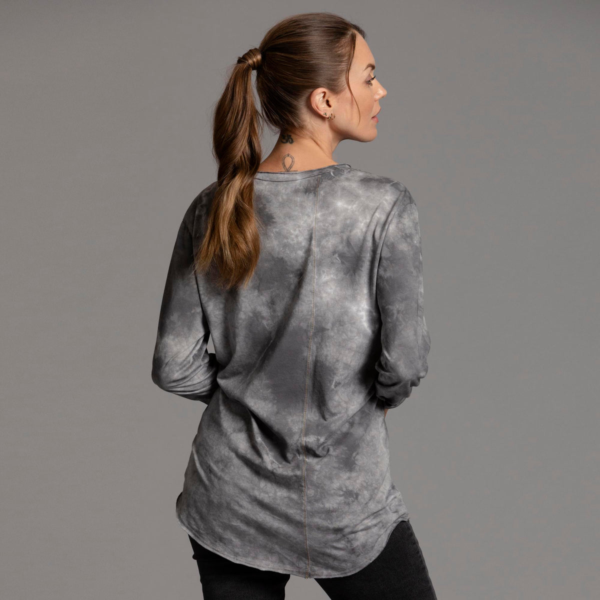 Woman modeling long sleeve crew shirt in rain cloud