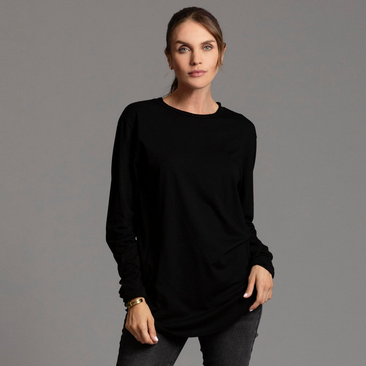Woman modeling long sleeve crew shirt in black