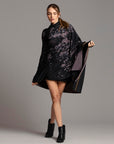 Woman modeling purple Benzova pattern nature wrap
