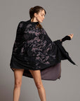 Woman modeling purple Benzova pattern nature wrap