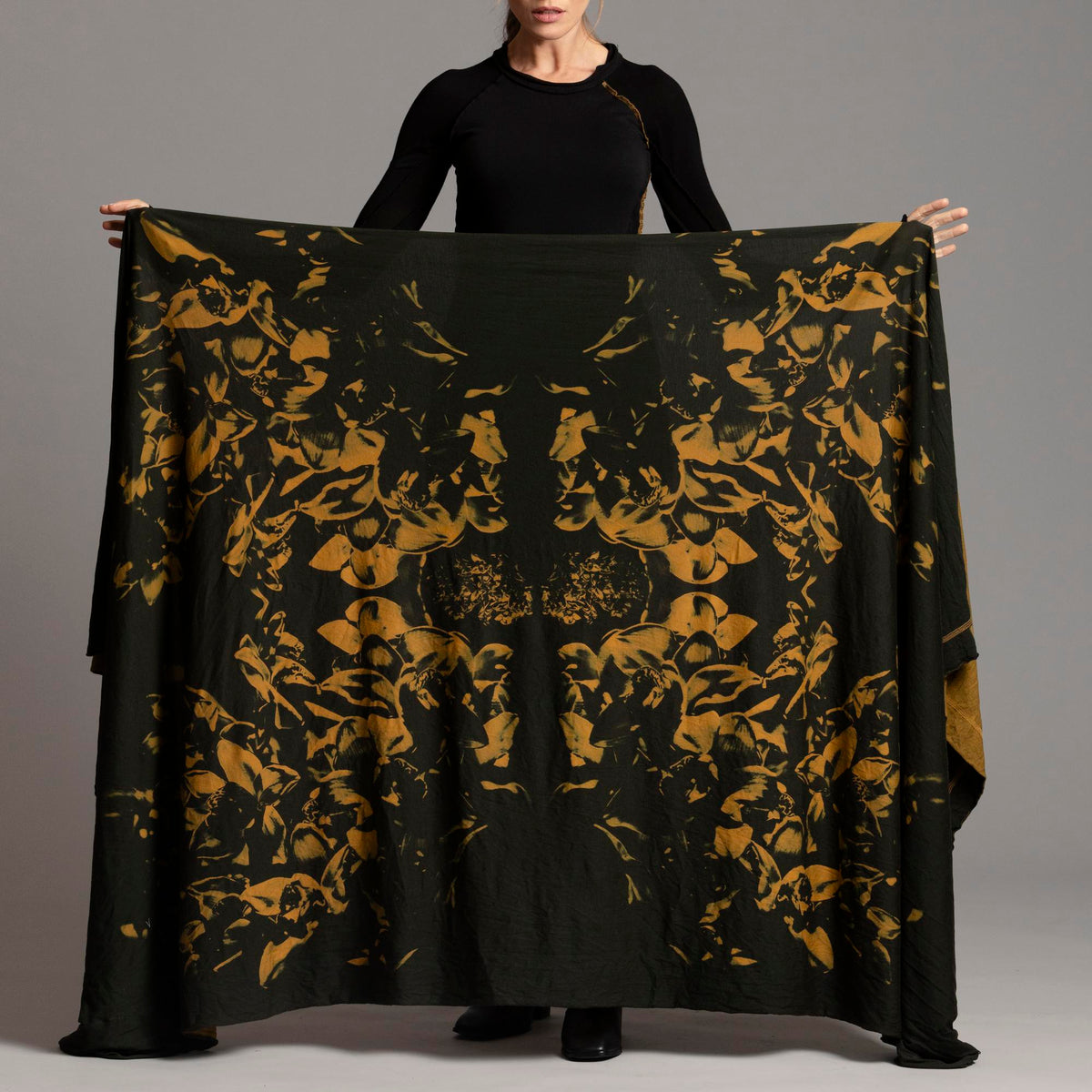 Woman modeling gold Benzova pattern nature wrap