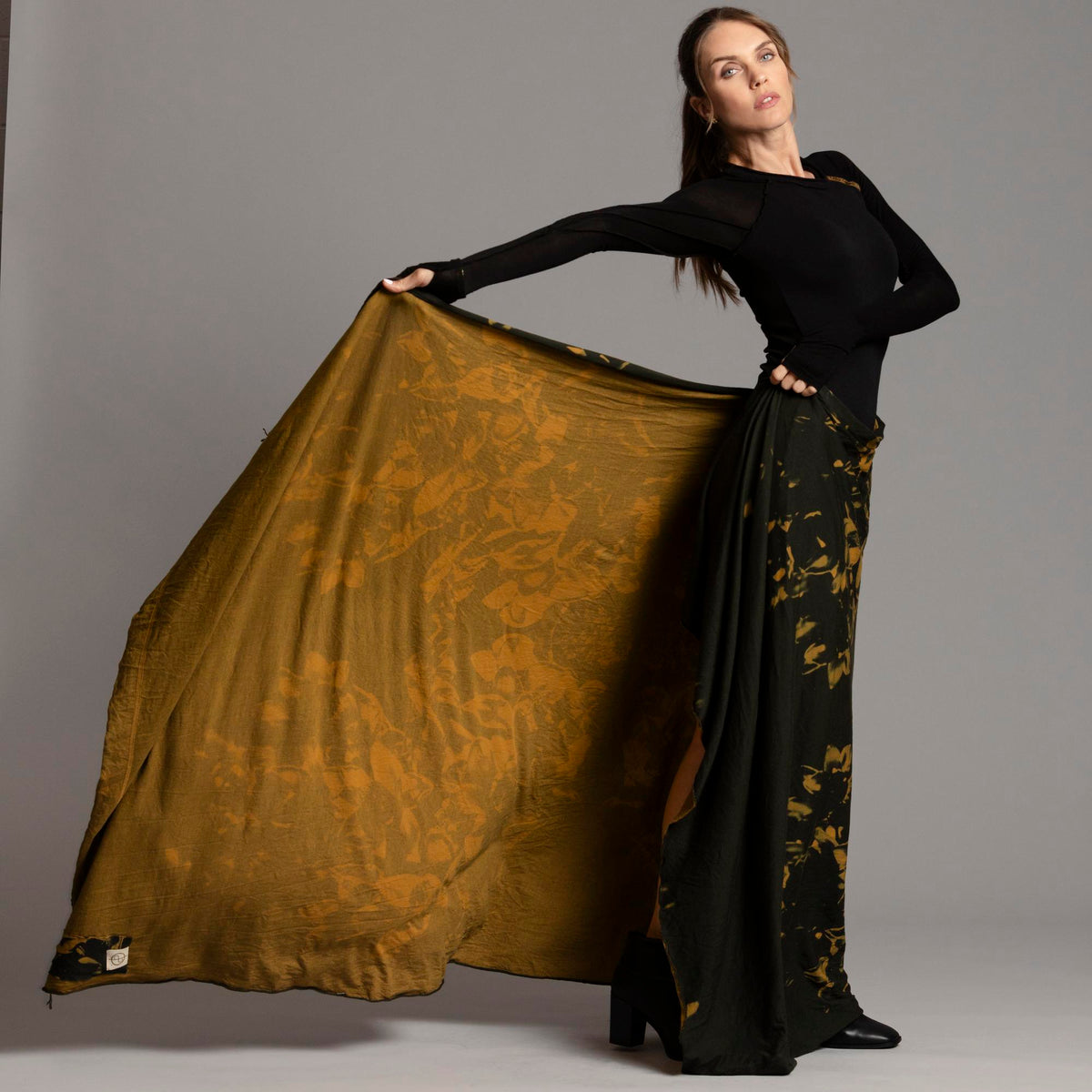 Woman modeling gold Benzova pattern nature wrap