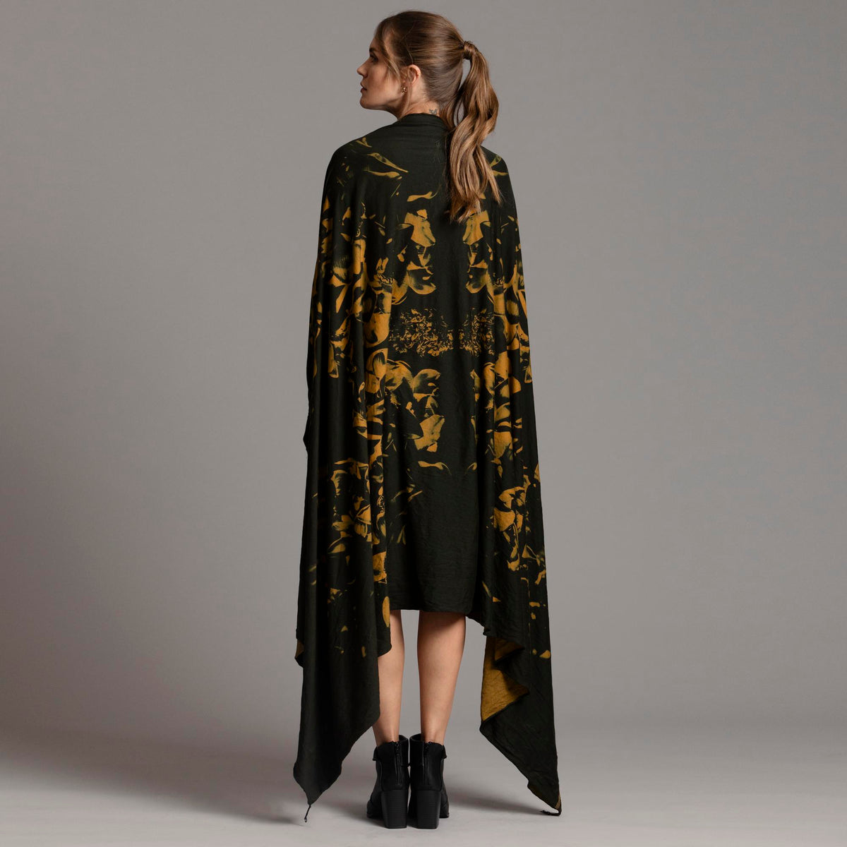 Woman modeling gold Benzova pattern nature wrap