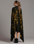 Woman modeling gold Benzova pattern nature wrap