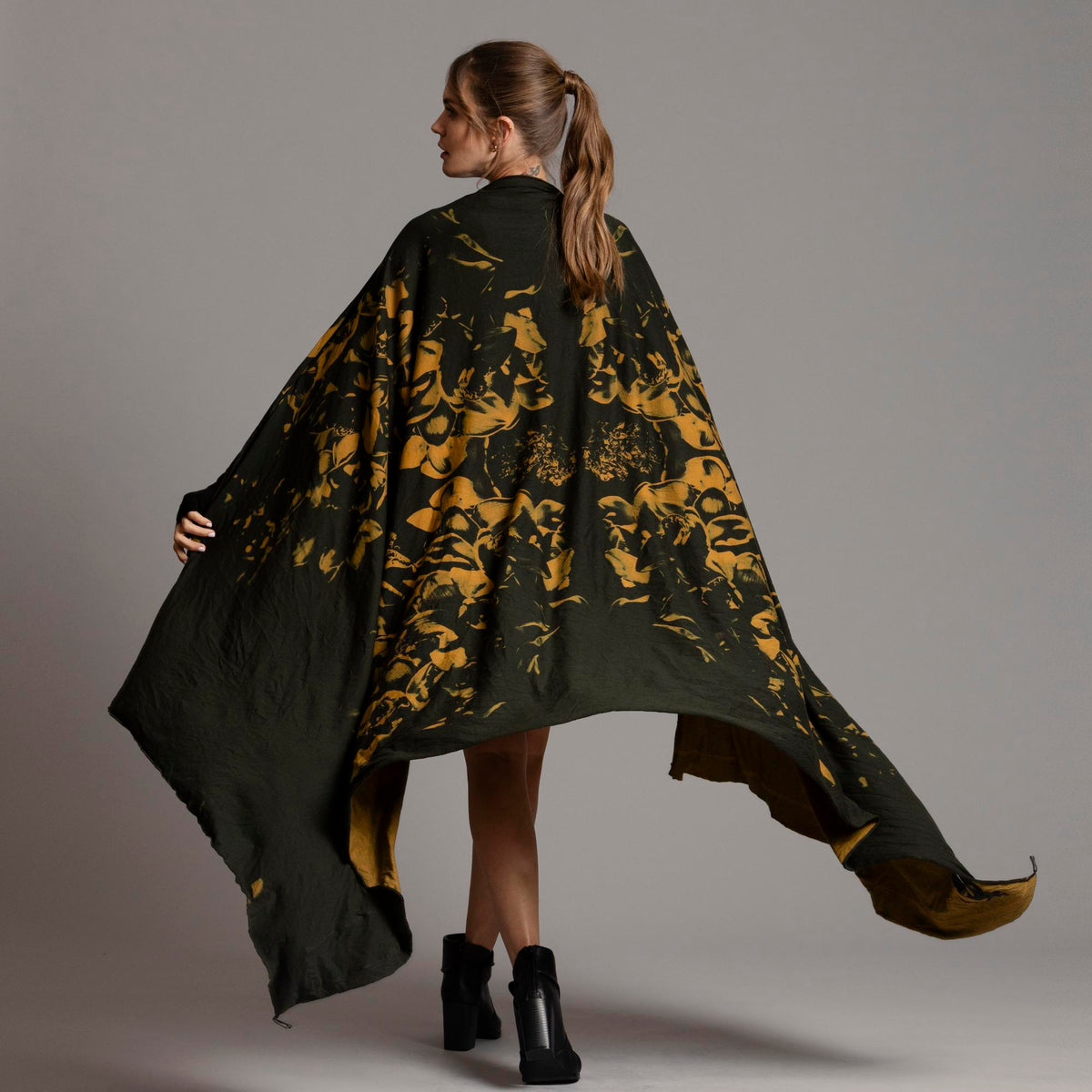 Woman modeling gold Benzova pattern nature wrap