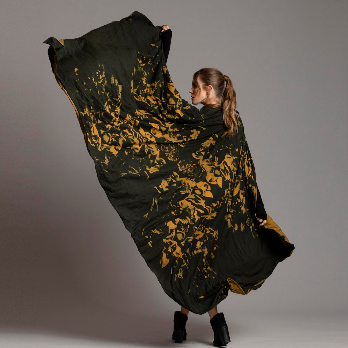 Woman modeling gold Benzova pattern nature wrap