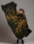 Woman modeling gold Benzova pattern nature wrap