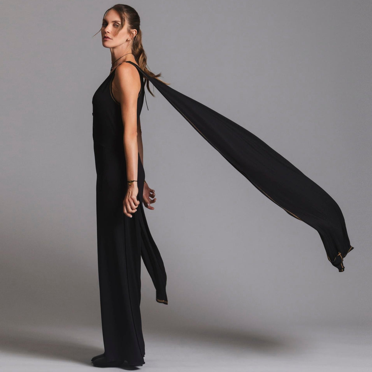 woman modeling the infinite bodysuit in black