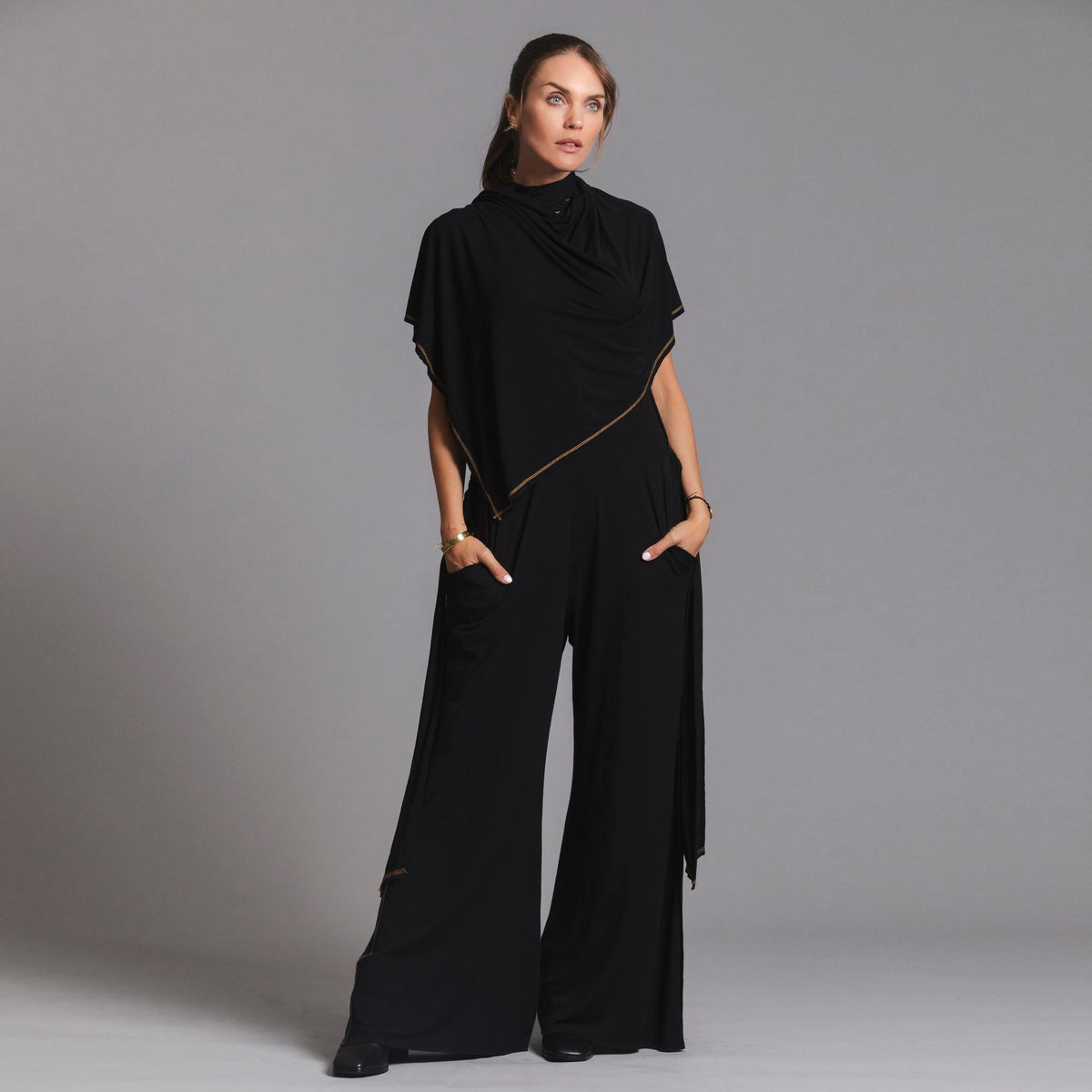 woman modeling the infinite bodysuit in black